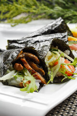Grilled eel assorted seaweed rolls placed on a placemat