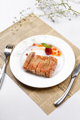 Crispy sizzling chicken steak on English wrapping paper