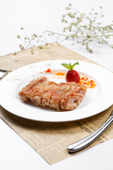 Crispy sizzling chicken steak on English wrapping paper