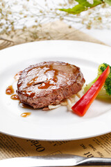 French fried fillet steak on English wrapping paper