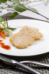 Japanese style grilled grouper on a placemat