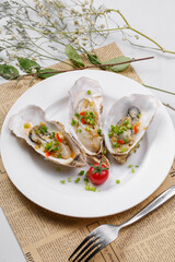 Garlic iron plate nourishing oysters placed on English wrapping paper
