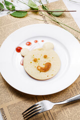 Blueberry jam bear biscuits are placed on English wrapping paper