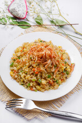 Sizzling shrimp fried rice on a straw mat