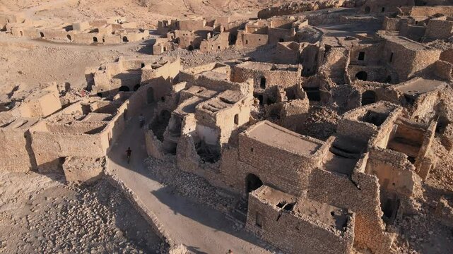 The ancient ruins of a city in North Africa with a mountain backdrop. Location: Tunisia, Gabes , Zraoua.