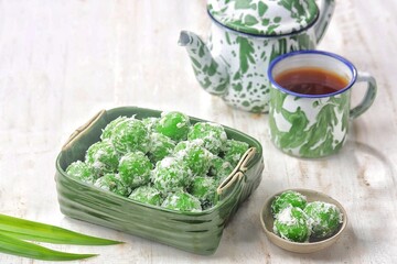 Klepon, also known as onde-onde, is a type of cake or steamed snack made from rounded sticky rice flour, filled with brown sugar and spread over grated coconut until it sticks.