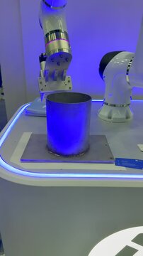 Robotic welding arm performs precision pipe weld on demo stand. Automated pipe welding with robotic welder ensures clean seam, stable arc. 