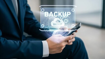 Businessman using smartphone with backup cloud technology interface in modern setting - Powered by Adobe