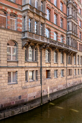 Historic canal building. Brick architecture. Urban facade