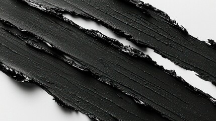 Three black textured strokes on a pale background
