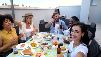 Happy friends taking selfie while having rooftop barbecue party - Powered by Adobe