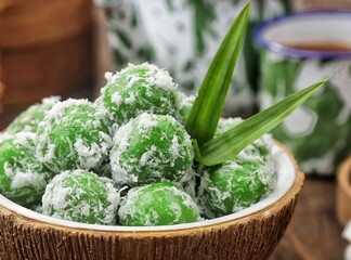 Klepon, also known as onde-onde, is a type of cake or steamed snack made from rolled sticky rice flour, filled with brown sugar and spread over grated coconut until it sticks.