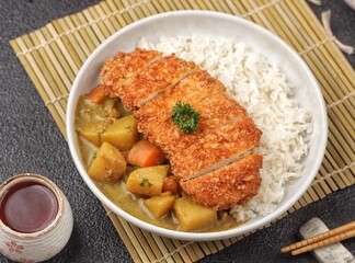 Chicken Katsu Curry is a Japanese curry dish with chicken katsu, sliced ​​chicken meat coated in crispy flour.