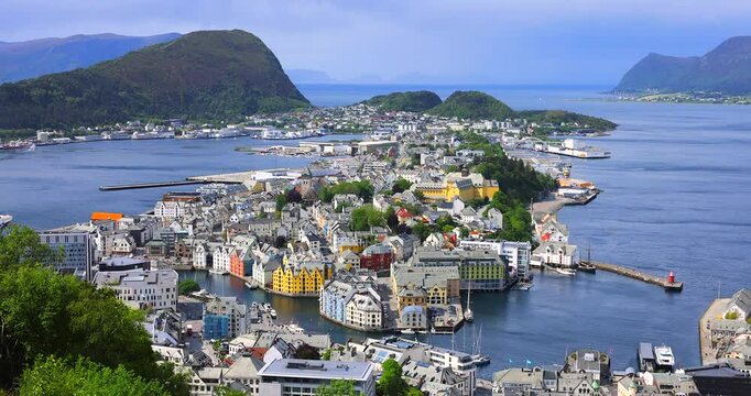 Alesund is a port town on the west coast of Norway, at the entrance to the Geirangerfjord. Panoramic views of Alesund  architecture, the surrounding archipelago and fjords from Mount Aksla lookout