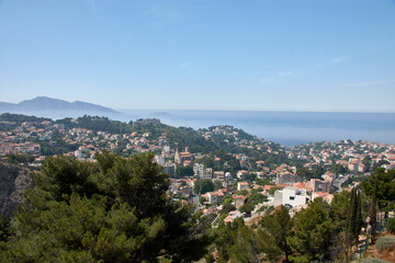 Aerial view of Marseille from the Notre Dame de la Garde observation deck with morning fog partially covering the city and skyline