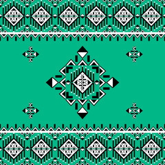 Geometric ethnic boho seamless pattern on a green background. Native ethnic pattern. Tribal pattern. Aztec ornament. Ideas for wallpaper, carpet, fabric vector, tiles, elaborate borders, and textiles.