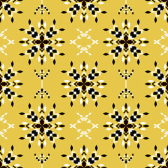 Tribal vector ornament. Seamless African pattern on a yellow background. Ethnic carpet with chevrons. Aztec style. Geometric mosaic on the majolica tile. Ancient interior. Modern rug. Kente Cloth.