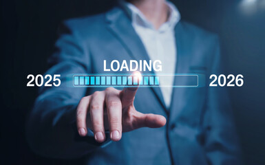 Businessman touching a virtual progress bar loading from the year 2025 to 2026, concept for a happy new year and future planning.