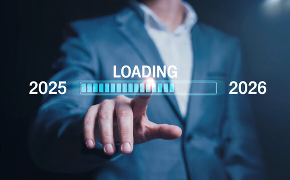 Businessman touching a virtual progress bar loading from the year 2025 to 2026, concept for a happy new year and future planning.