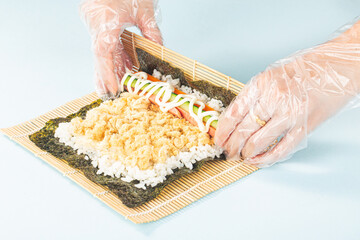Close up of the process of making delicious sushi