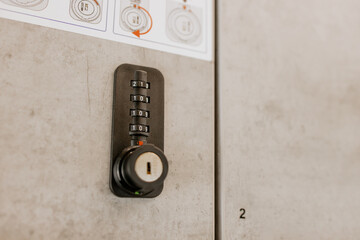 Close up of modern secure storage lockers with digital code locks and user instructions, located in...