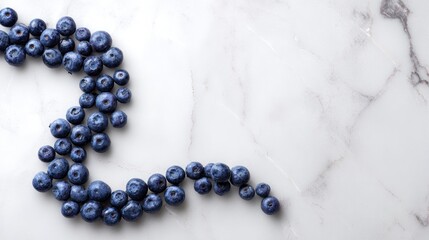 Fresh Blueberries Arranged in a Wavy Pattern on a Luxurious White Marble Background