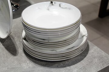 stack of plates on the table, dishes on the table