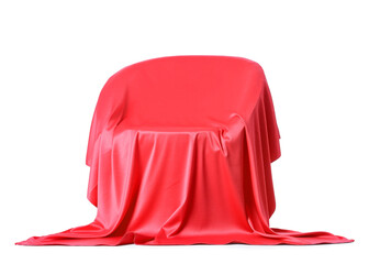 Red velvet curtain covering armchair on white background