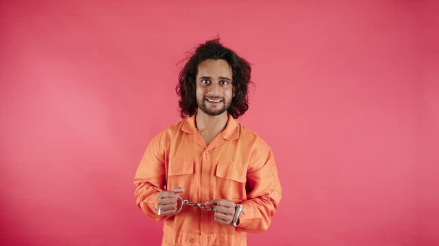 Furious Prisoner Stand Handcuffed with Wild Gaze