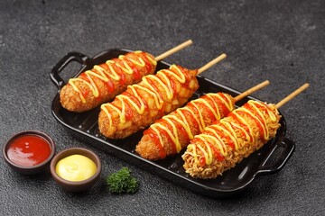 Corndog is a food made from skewered sausages (usually hot dogs) coated in a thick layer of cornmeal and fried.