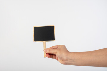 Empty post blackboard in hand isolated on white background.