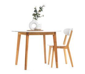 Stylish dining table with eucalyptus branches and chair isolated on white background