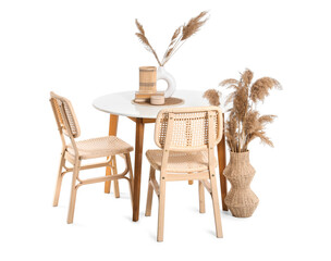 Stylish table with pampas grass and chairs isolated on white background
