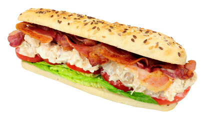 Chicken mayonnaise and bacon sandwich with fresh salad in a crusty multi seed topped baguette bread roll isolated on a white background