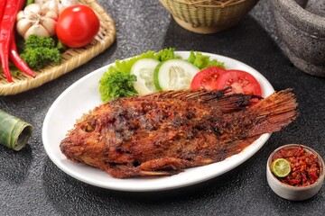 Ikan Bakar. Grilled fish is a fish dish that is grilled or roasted over a fire or embers.
