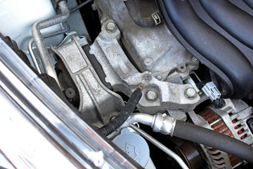 Upper engine mount close up. Gasoline engine parts. Engine mount in the upper part of car. Engine...