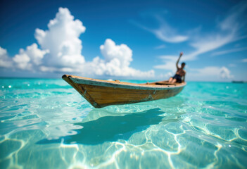 Fototapeta premium A person relaxing on a small wooden boat floating on clear turquoise water under a bright blue sky