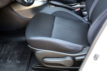 Gray textile drivers seat in a luxury SUV. Fabric car interior. Gray drivers seat in the car. Front seats of a modern passenger car.
