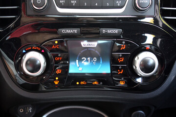Automatic climate control with a temperature of 21 degrees. Car air conditioning on minimum cold setting. Detail interior of vehicle. Air conditioning of a modern car. Vehicle Conditioner.