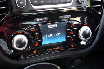 Set Automatic Climate Control off. Car air conditioning on minimum cold setting. Detail interior of vehicle. Air conditioning of a modern car. Vehicle Conditioner Power Regulator