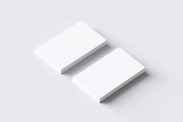 Two blank business cards mock up positioned on a clean white surface, showcasing minimalistic design and ample copy space for branding and personalization purposes