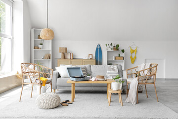 Interior of living room with swimsuit, sofa and armchairs