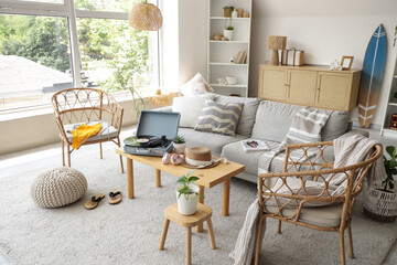 Interior of living room with swimsuit, sofa and armchairs