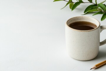 Minimalist work desk flat lay with planner, tea, pencil, and plants