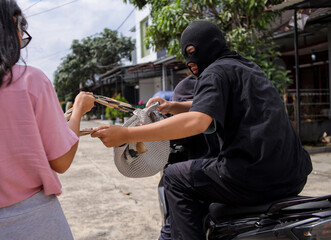 Thief On Motorbike Trying To Steal Woven Bag From Woman