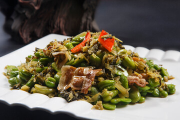 Fried broad beans with pickled mustard greens and pork