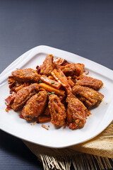 Spicy fried chicken wings with sweet potato fries