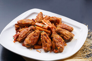 Spicy fried chicken wings with sweet potato fries
