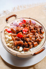 Casserole with Garlic and Pig's Tail