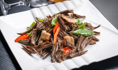 Stir-fried pork belly with bell pepper and pine mushrooms